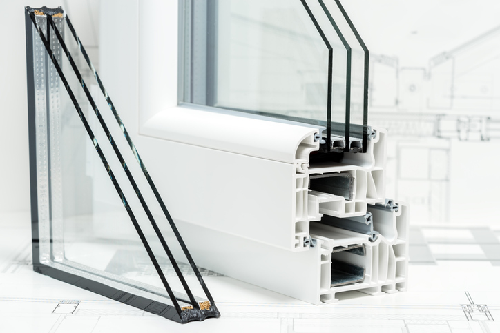 A cross section of window Design of pvc profiles for window, triple glazing cross selection, technical drawing on background.