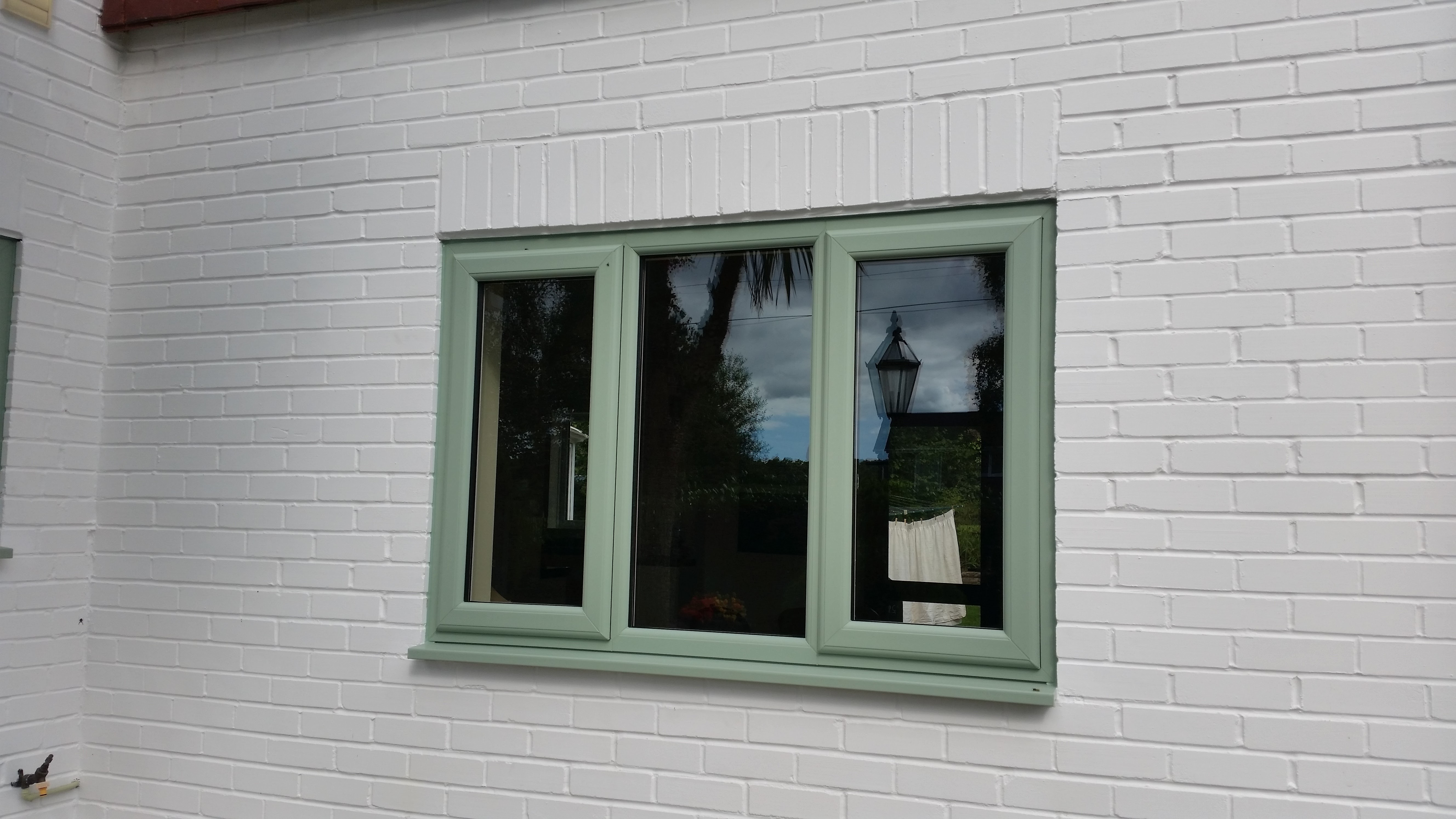 Pastel green new PVC window