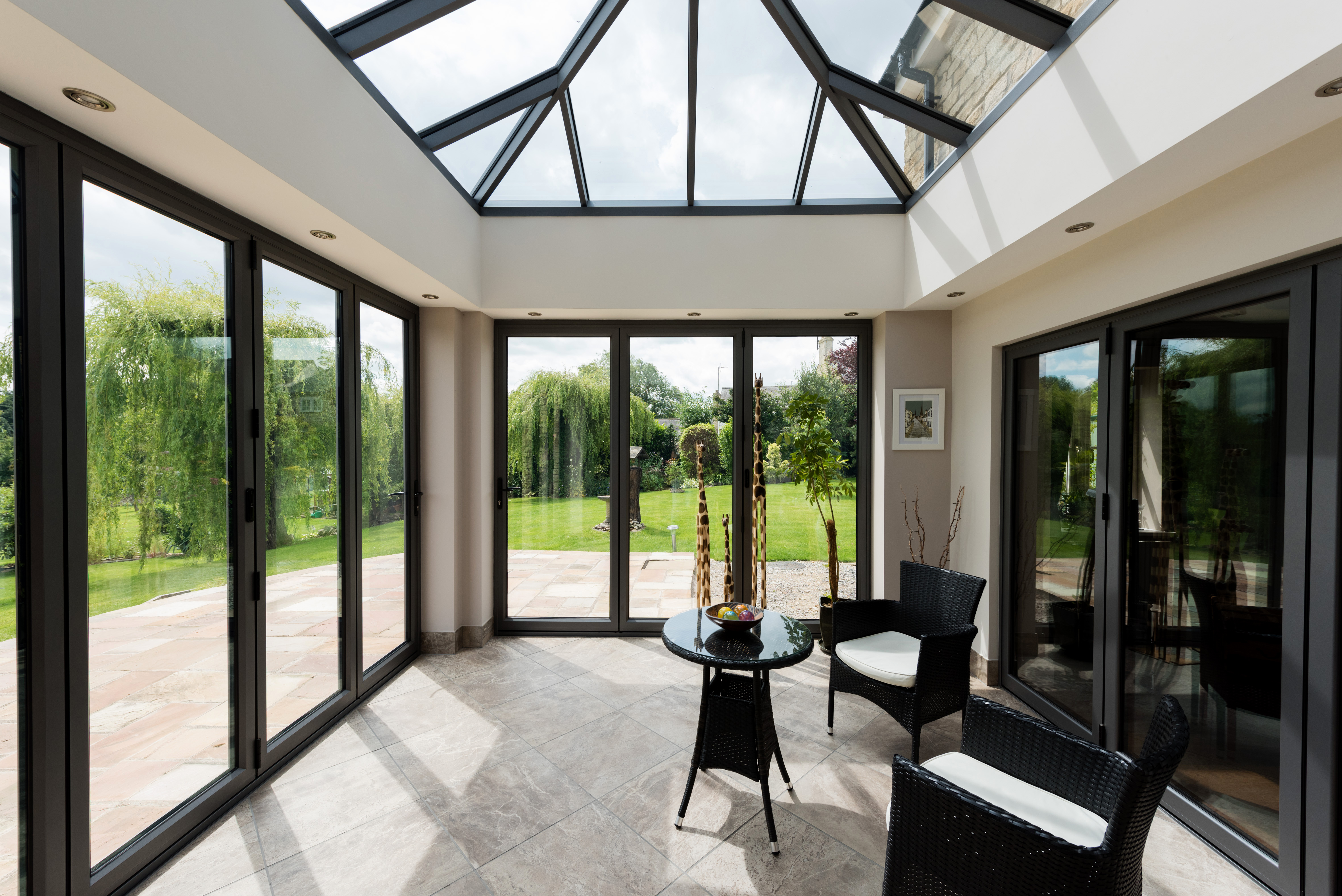 Bright and spacious Livin room conservatory design.