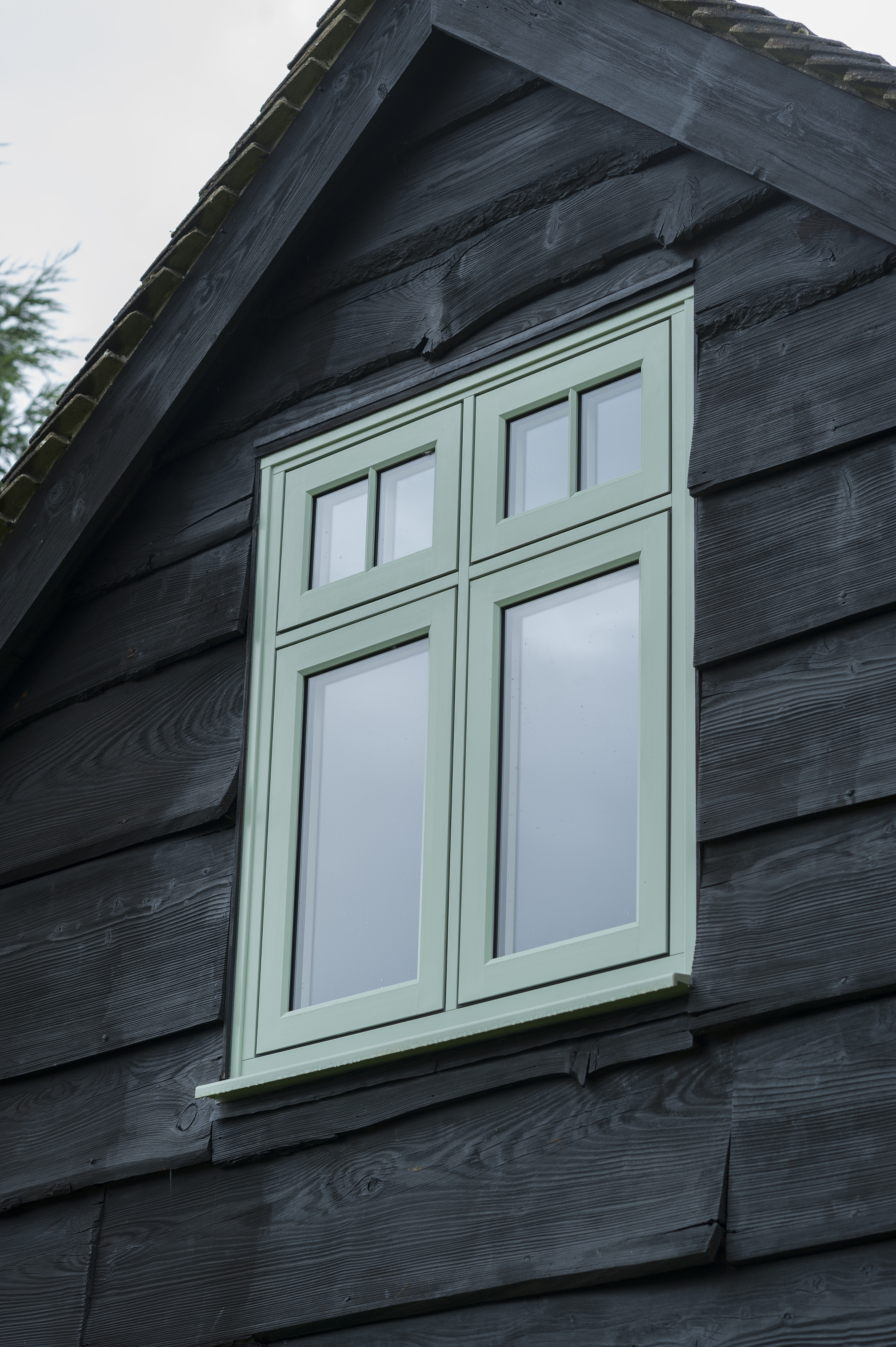 Beautiful pastel green heritage window design.