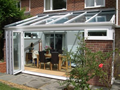 New conservatory design with practical sliding french doors.