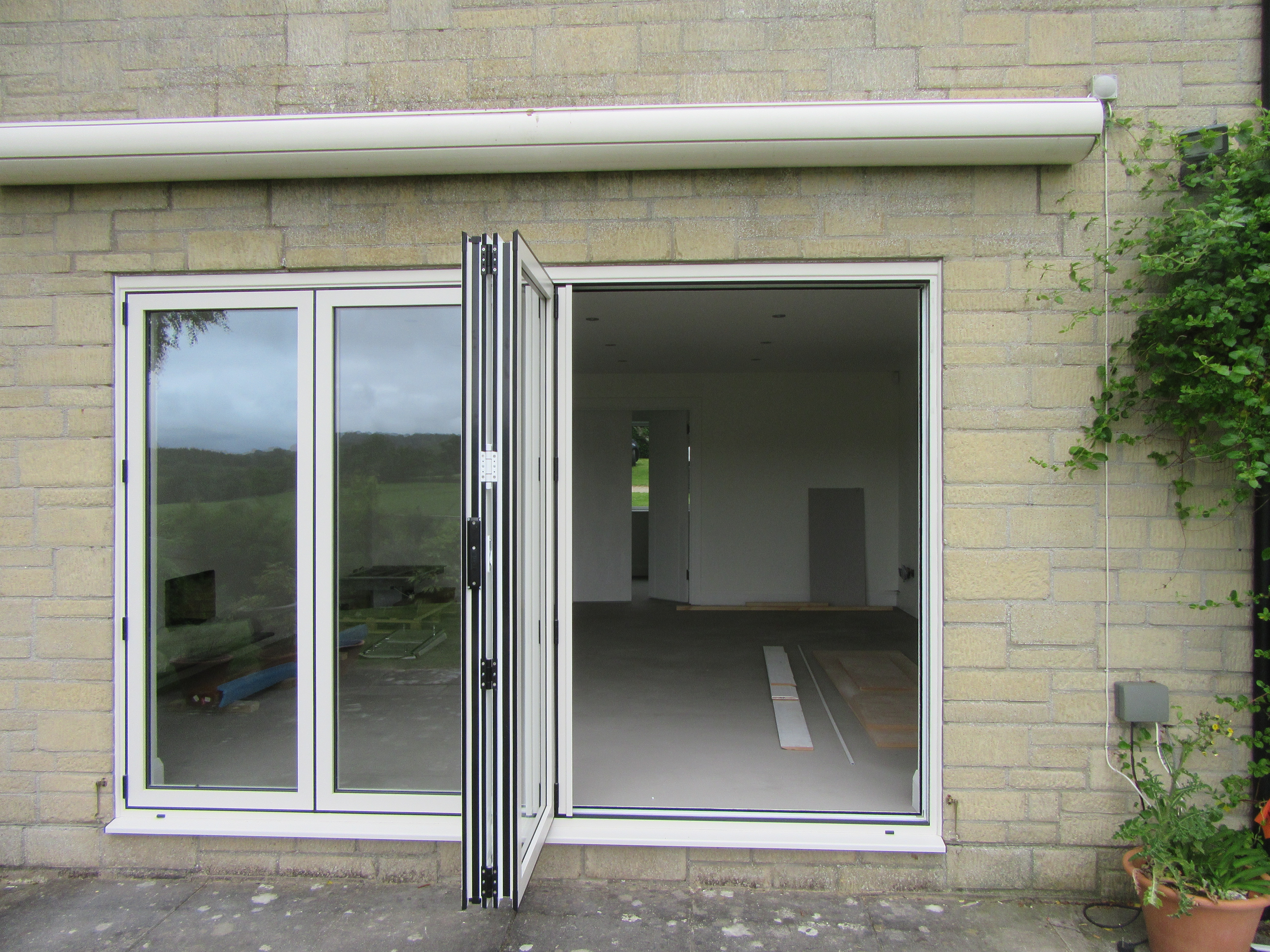 New french doors with Aluminium Bi-Fold leading onto a new patio.