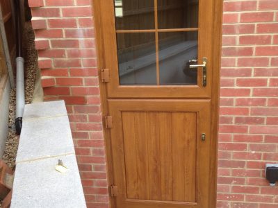 Warm and woody new PVC front door