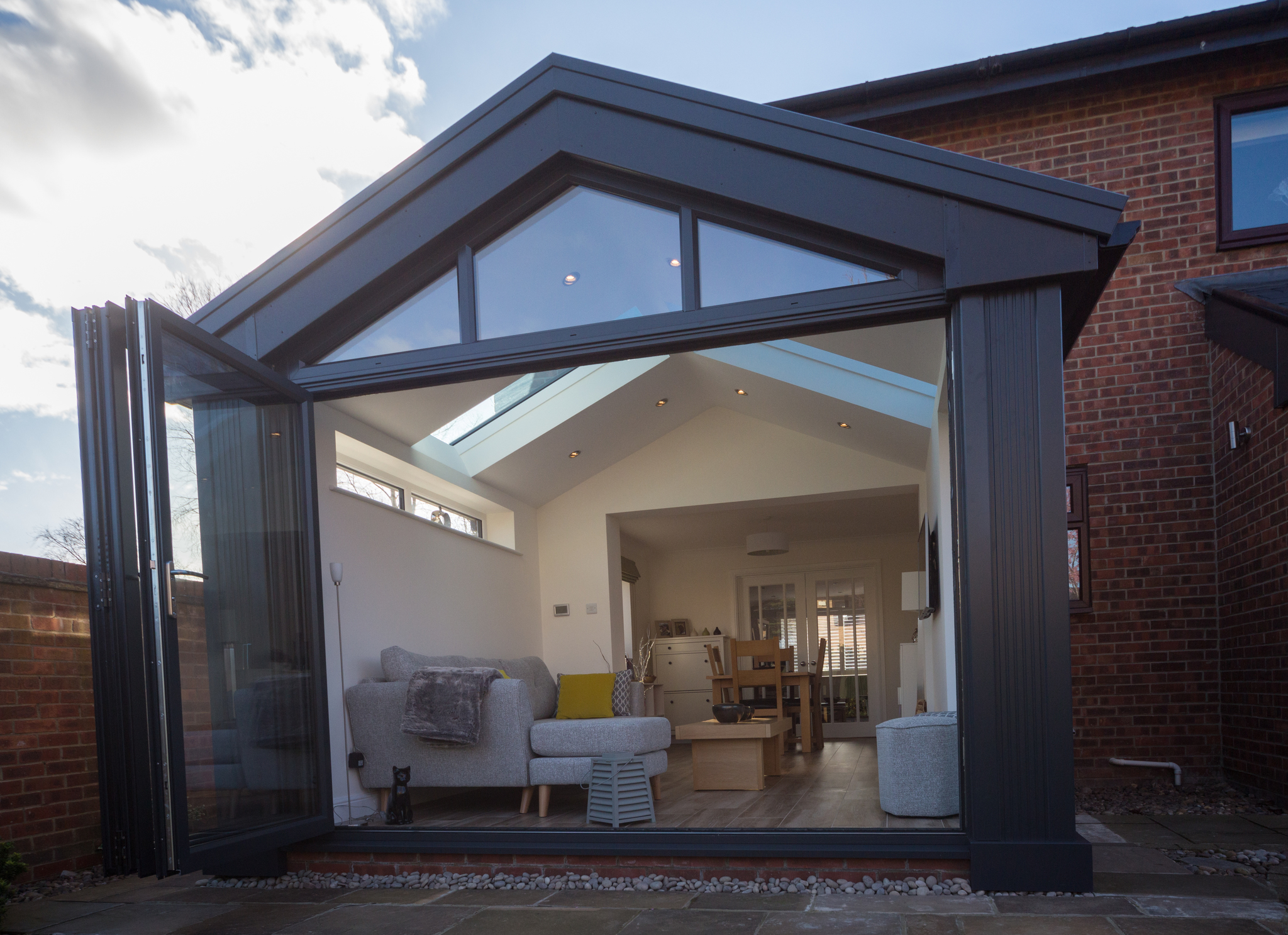 Example of a new conservatory installation with new bifold doors from 21st Century Conservatories & Fascias